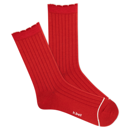 Red socks with white trim on a white background