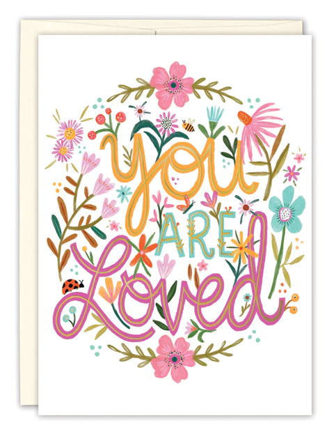 front of card is white with orange, blue and pink text surrounded by flowers and listed in the description, white envelope behind it and displayed on a white background