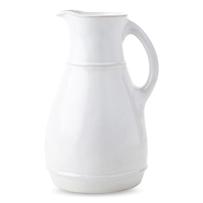 white ceramic pitcher on white background