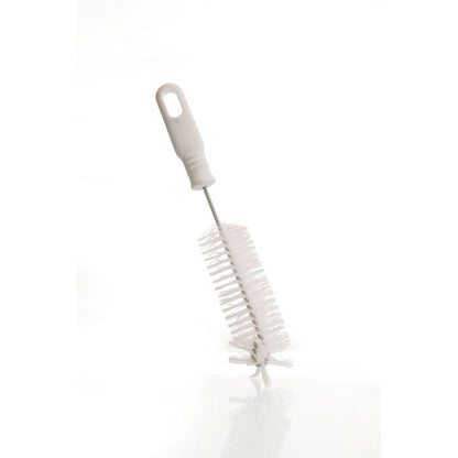 bottle brush at an angle on a white surface