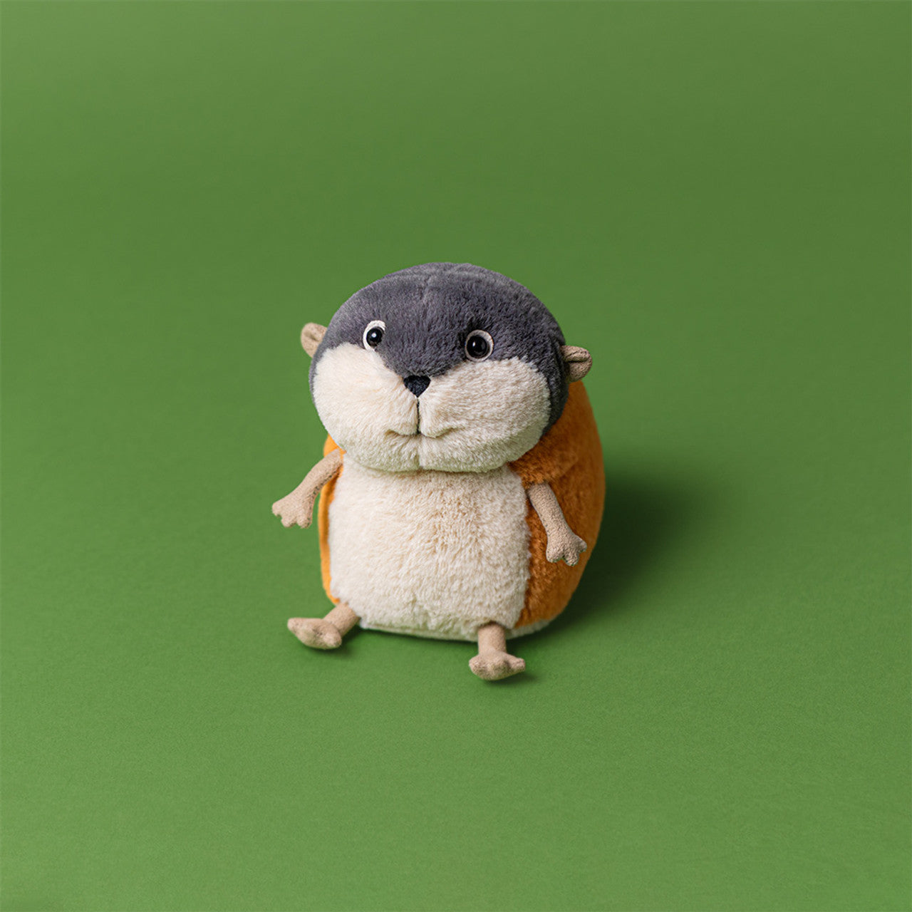 Lambeth Lemming Plush Toy sitting on a green background