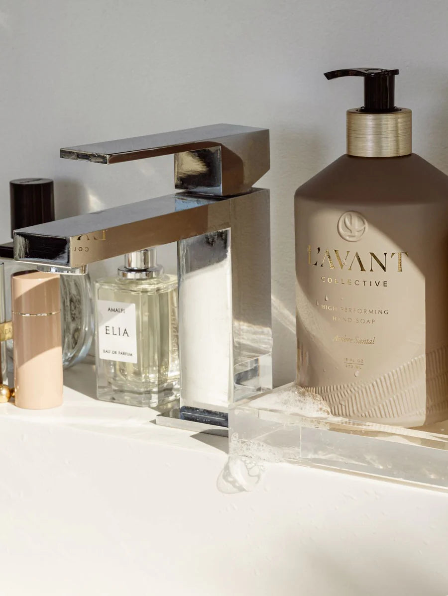 ambre santal hand soap set on a bathroom counter by the sink