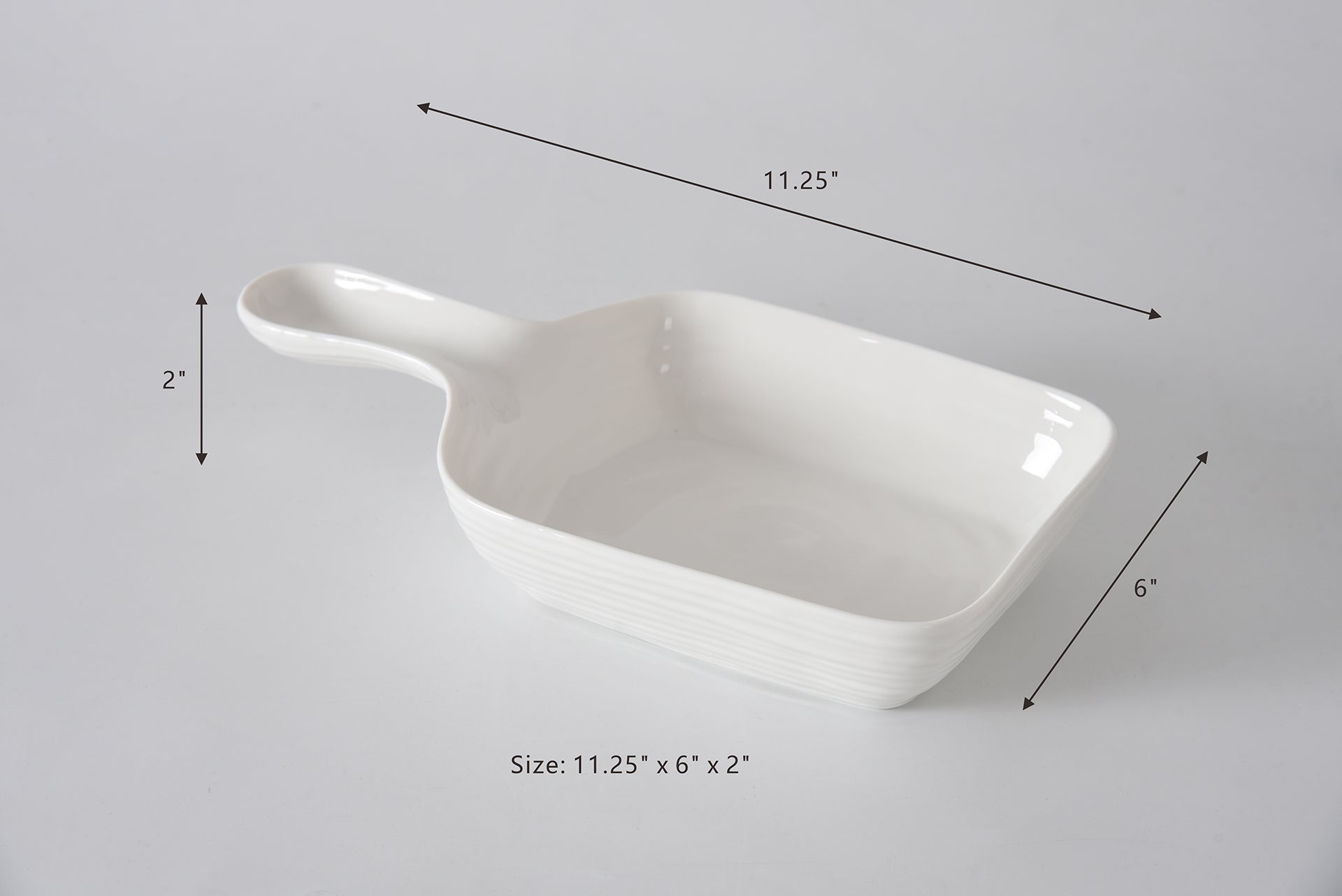 White ceramic dish with dimensions labeled on a gray background