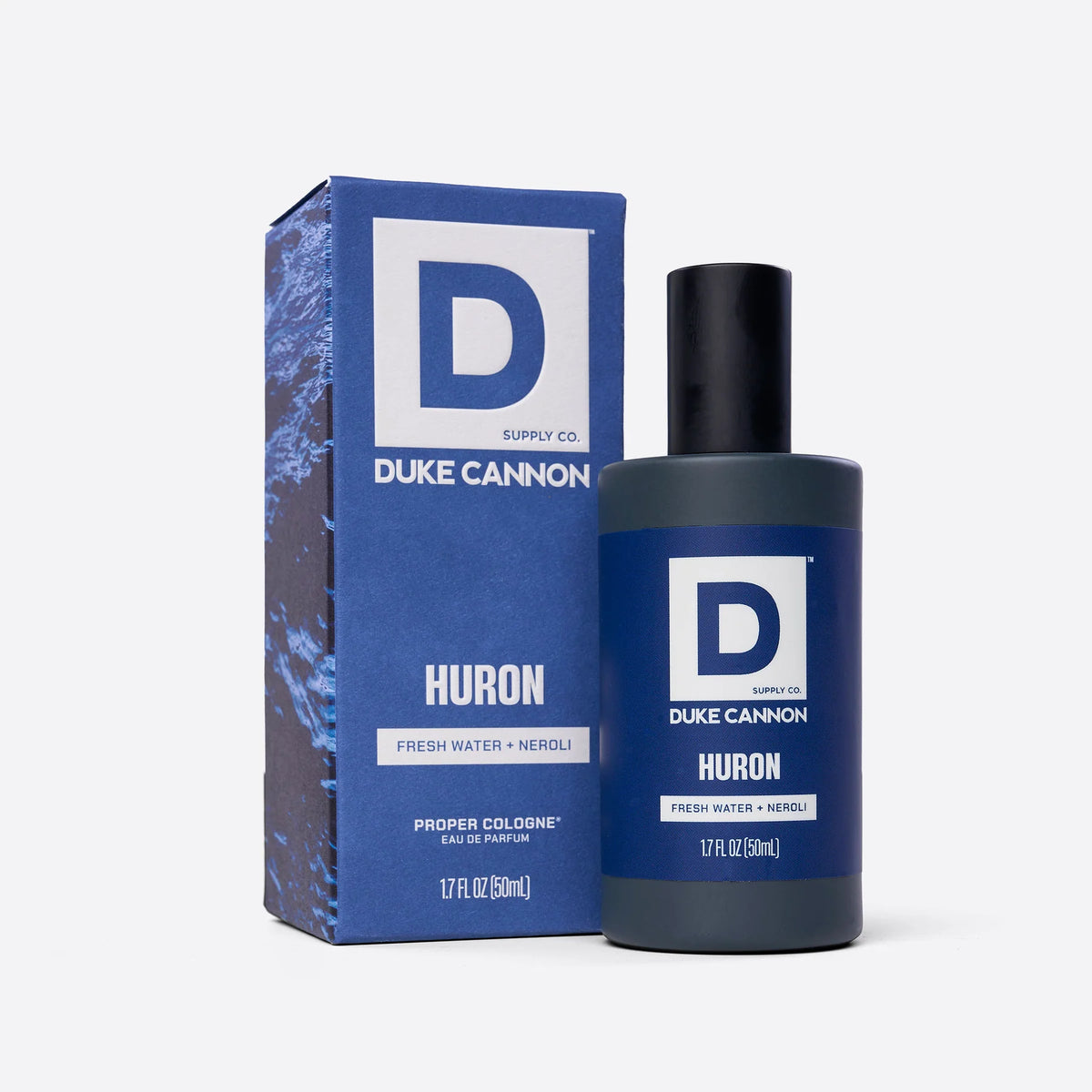 Bottle of Huron Proper Cologne next to its box