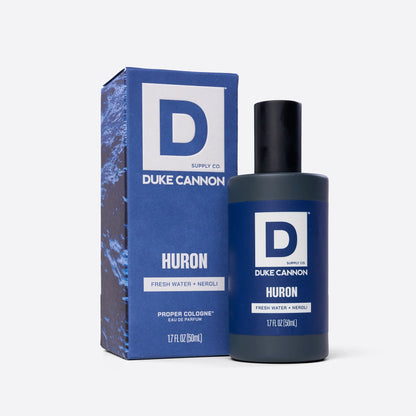 Bottle of Huron Proper Cologne next to its box