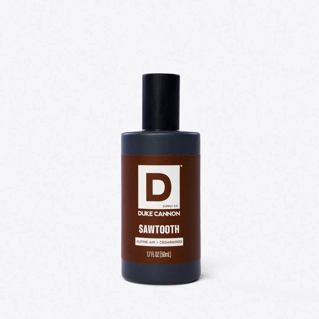 bottle of sawtooth cologne with a brown label shown on a white bckground