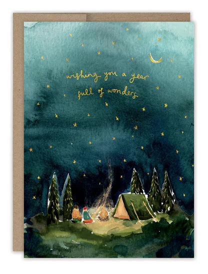 front of card featuring starry night camping scene with gold stars and text