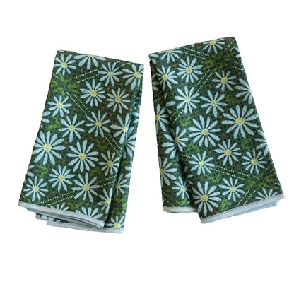 2 dark green biggie towels with blue daisies printed on them.