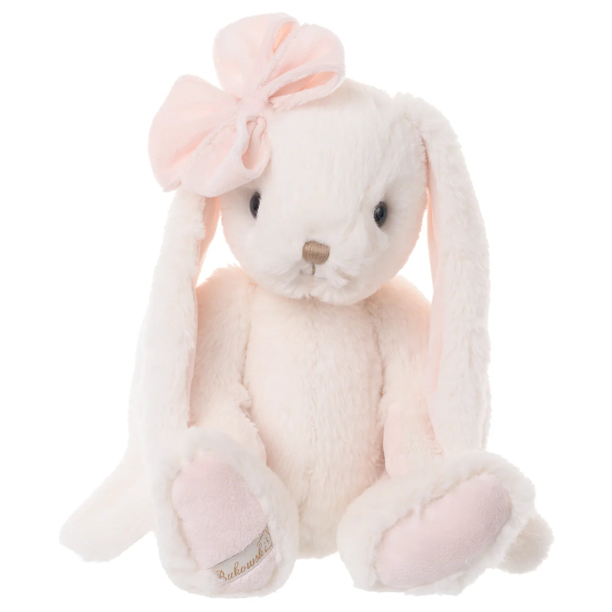 very pale pink Plush bunny toy with a pink bow on one ear seated on a white background