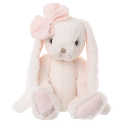 very pale pink Plush bunny toy with a pink bow on one ear seated on a white background
