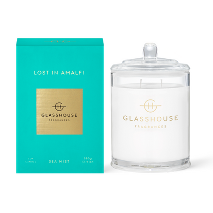 Lost In Amalfi Triple Scented Candle jar displayed next to the turquoise box against a white background