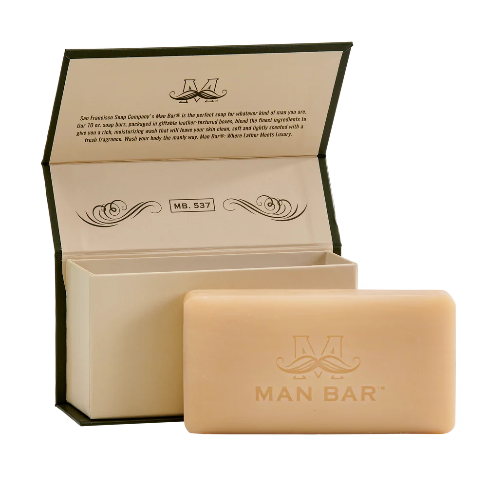 bergamot cognac invigorating man bar set next to its open box packaging