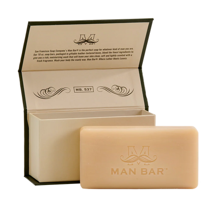 bergamot cognac invigorating man bar set next to its open box packaging