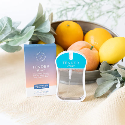 Tender body mist and its packaging packaging with fruits and leaves in the background
