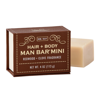 redwood and clove man bar mini ser next to its brown box packaging
