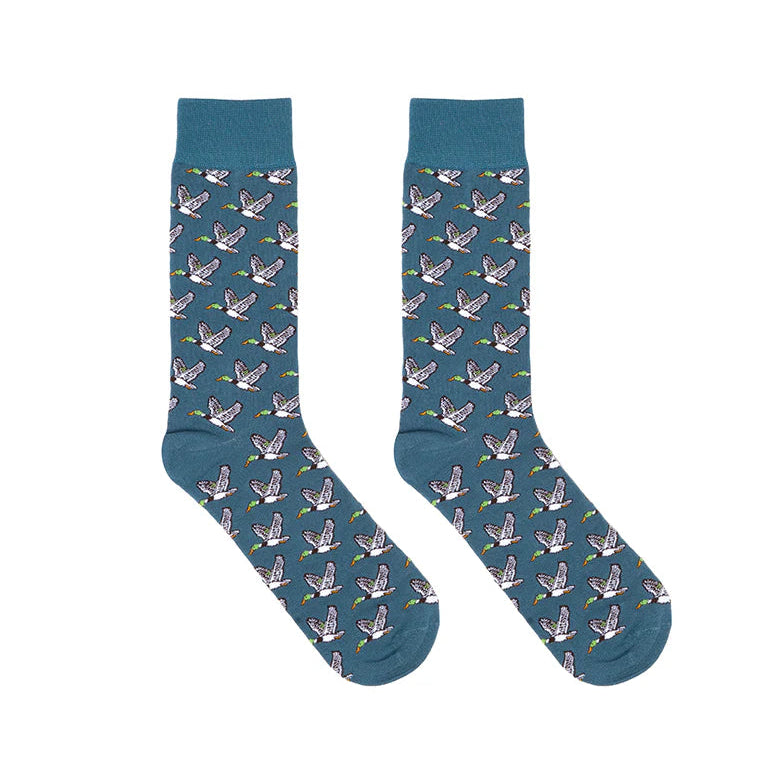 Pair of blue socks with duck pattern on a white background