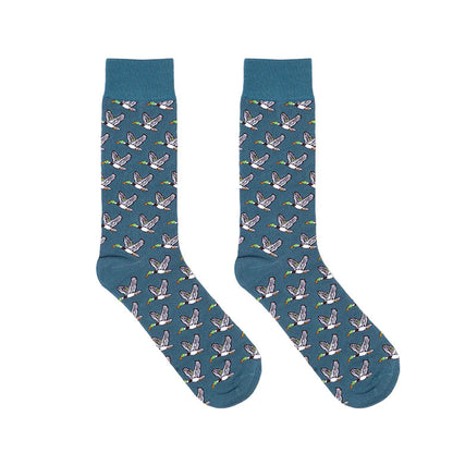 Pair of blue socks with duck pattern on a white background