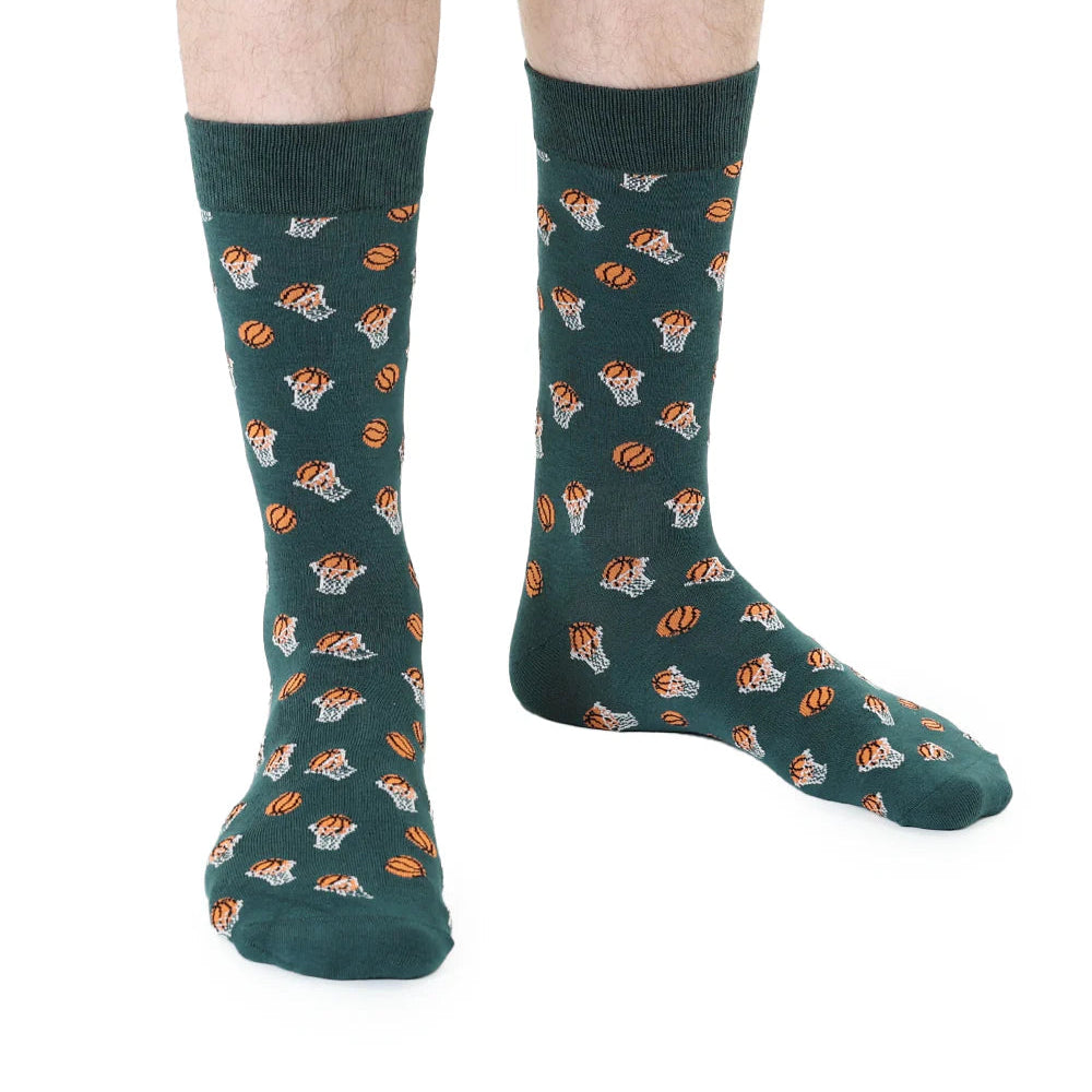 Green socks with basketball pattern worn by a person on a white background