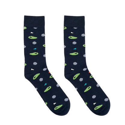 Pair of navy socks with green gold themed pattern on a white background