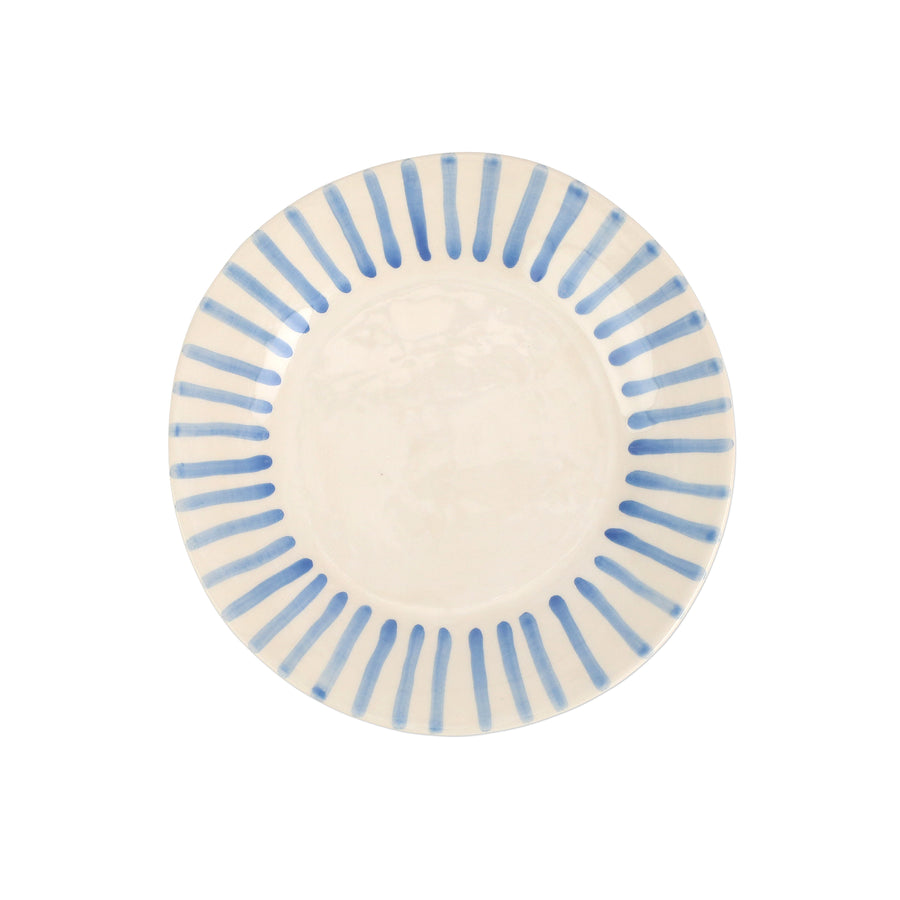 top view of modello salad plate that is white with blue lines radiating around the rim.
