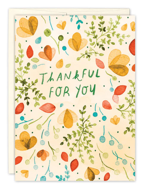 front of card is white with pink, orange, and gold flowers, and greenery all over, green text listed in the description, white envelope behind it and displayed on a white background