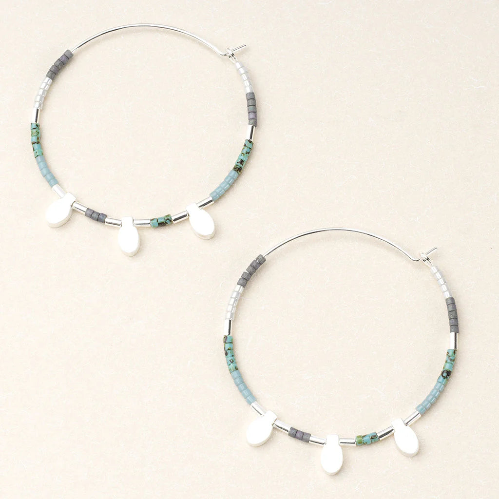 hoop earrings beaded with turquoise and silver beads.