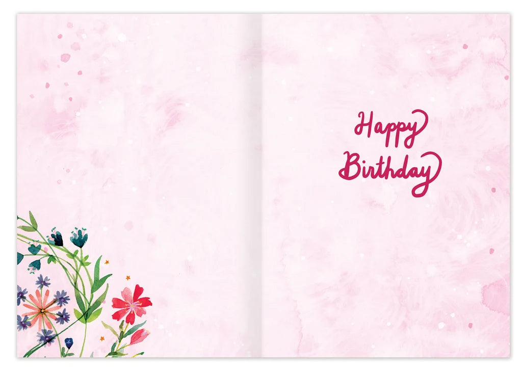 inside of card featuring flowers and pink text
