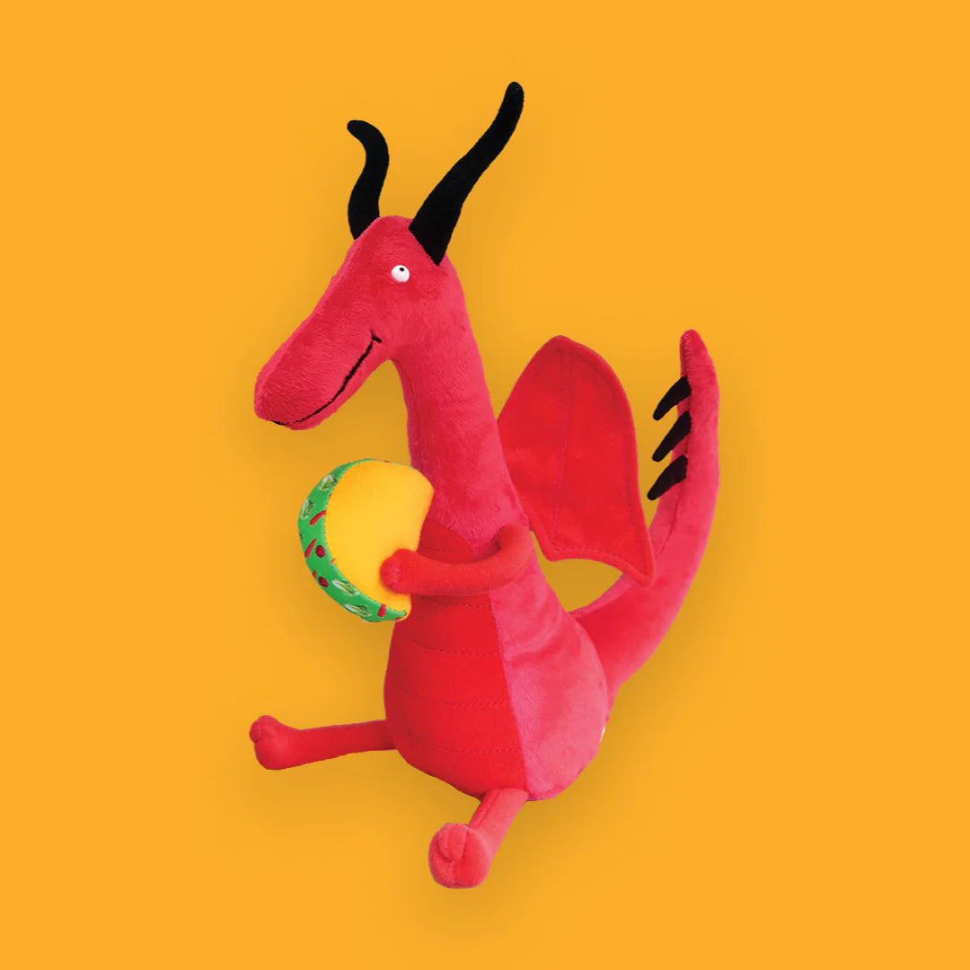 Dragons Love Tacos Plush Toy shown on an orange background.