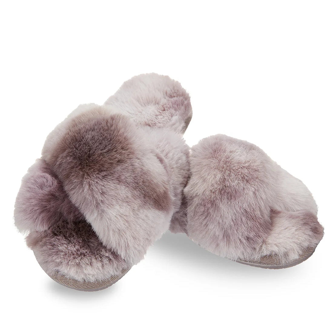 Pair of fluffy lavender slippers laying slightly overlapping on a white background