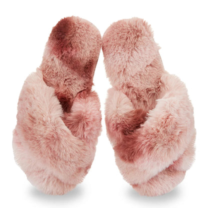 Pair of pink fuzzy slippers on a white background