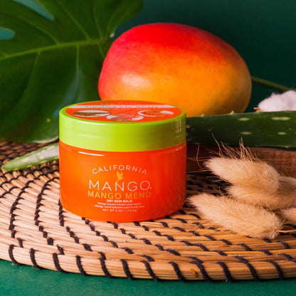 Jar of California Mango product on a woven mat with a mango in the background
