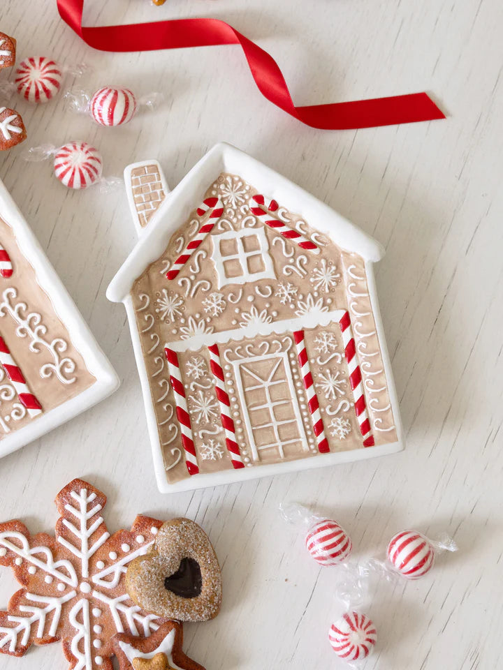 Gingerbread House Appetizer Plate set on a table with cookies and candies.