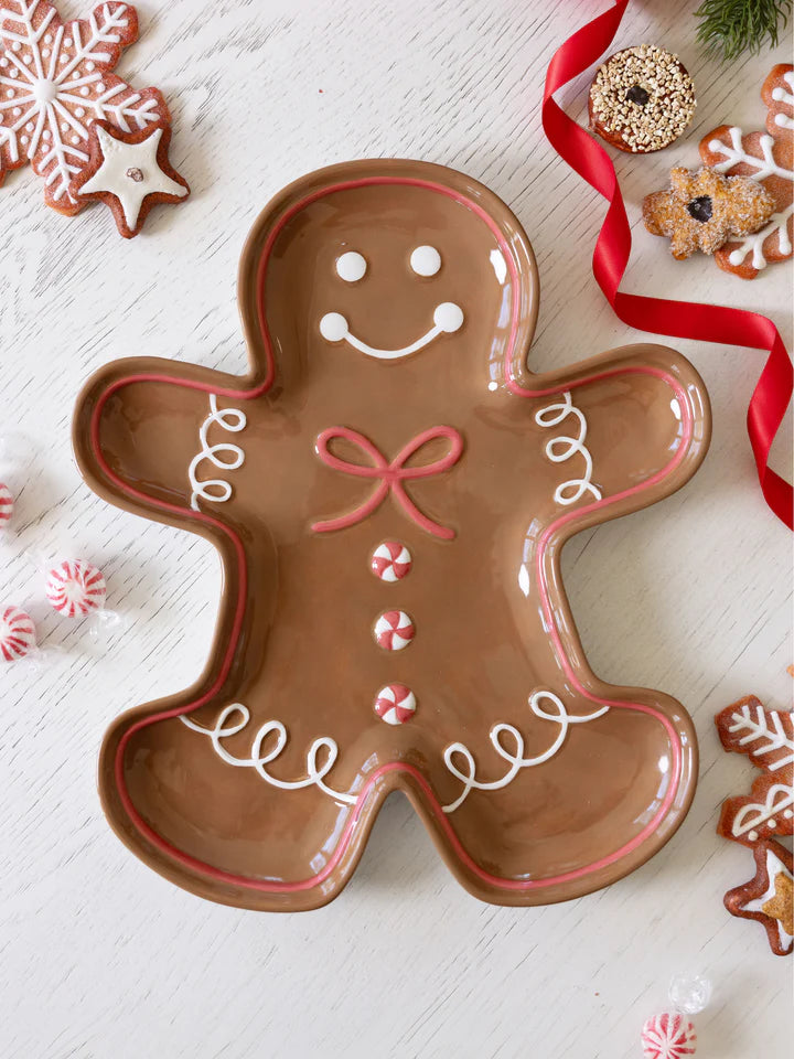 Gingerbread Man Platter set on a table and surrounded by holiday cookies.