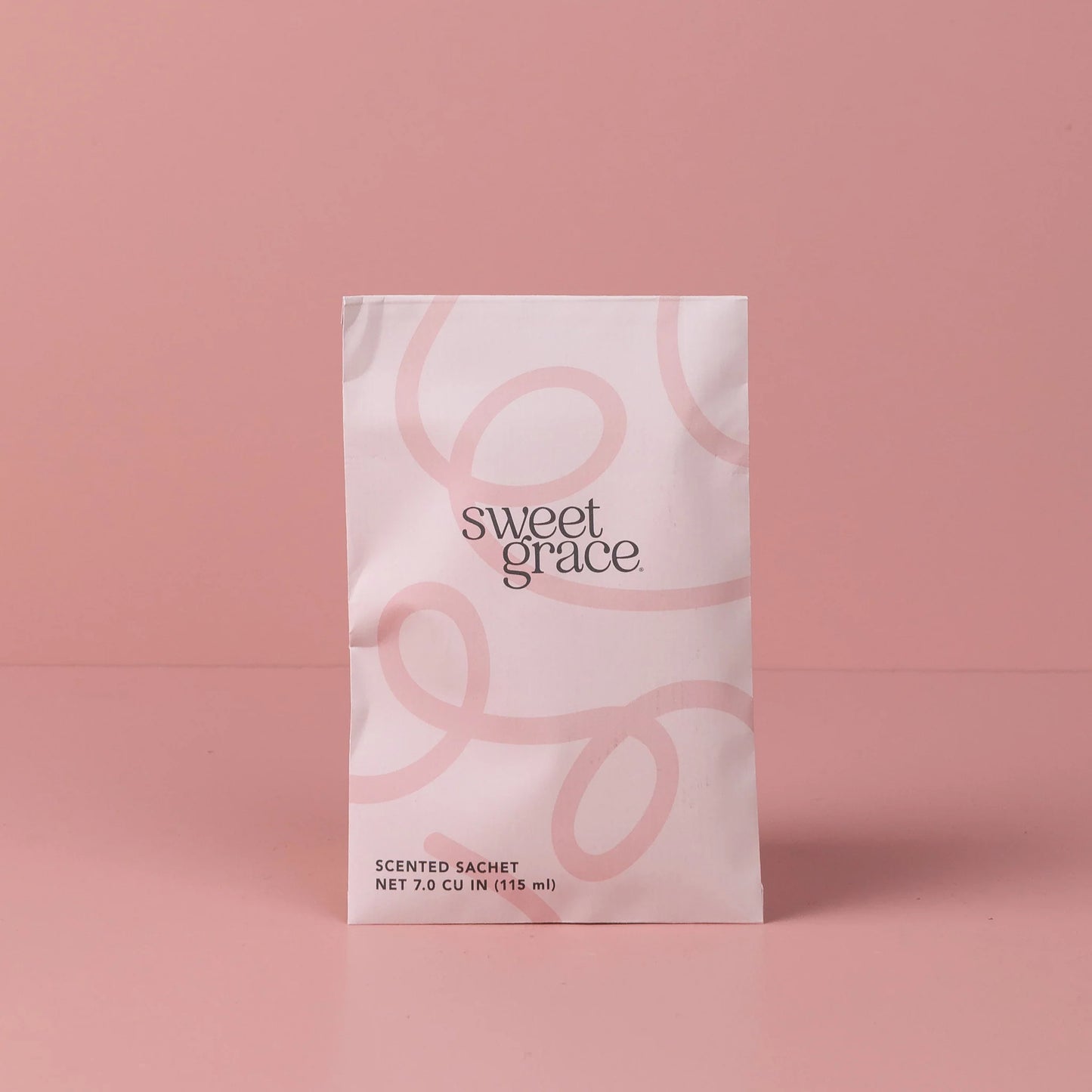 Sweet Grace Scented Sachet with modern swirl design of pink hues