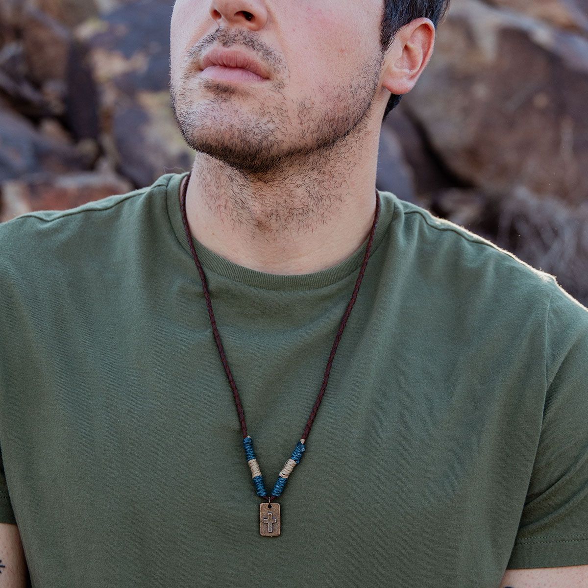 guy wearing green t shirt and Aadi Guardian Cross Necklace