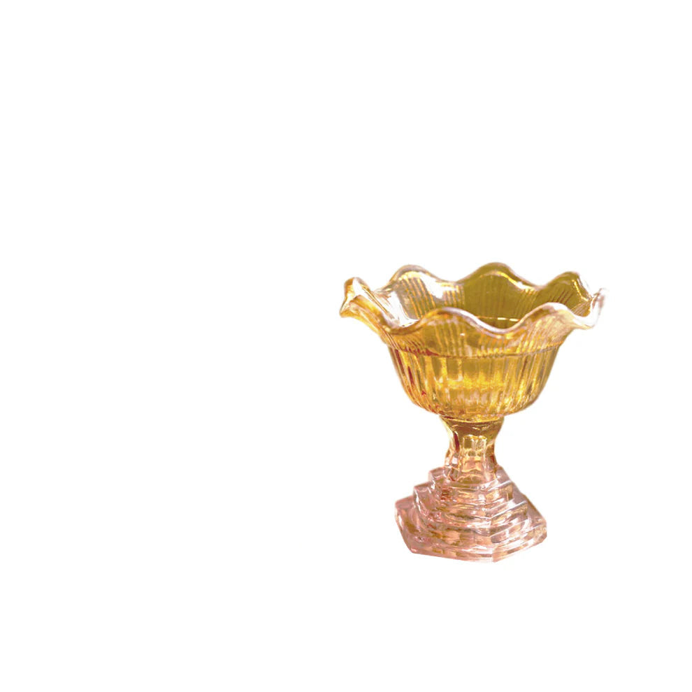 small glass bowl with amber basin and blush pedestal