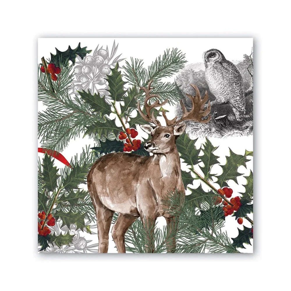 paper napkin printed with a buck and an owl in the foreground and winter botanicals behind them.