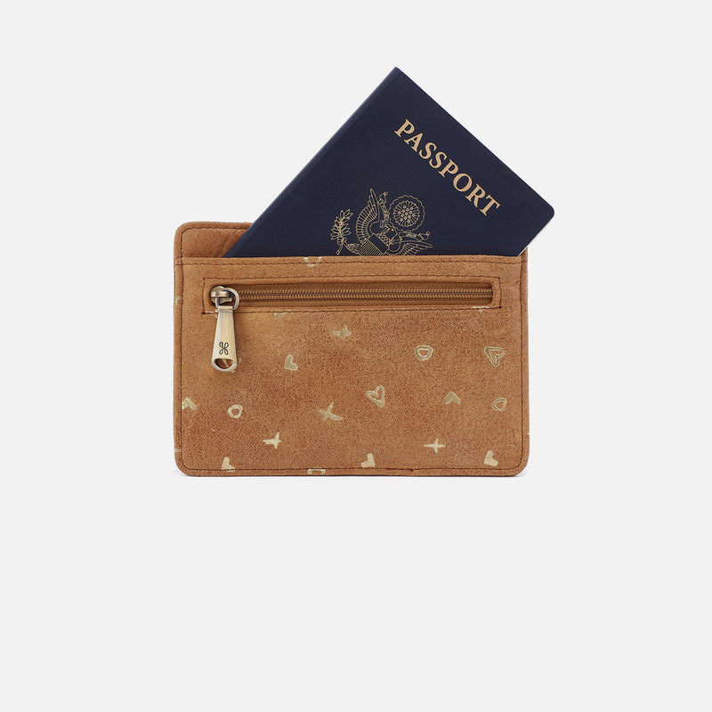 back view of whiskey brown leather card and passport holder with gold details