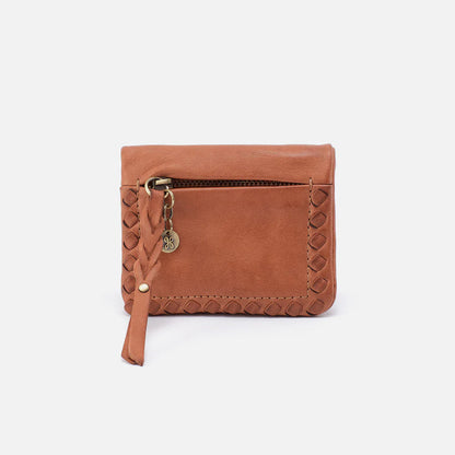 Brown leather wallet with braided trim on a white background