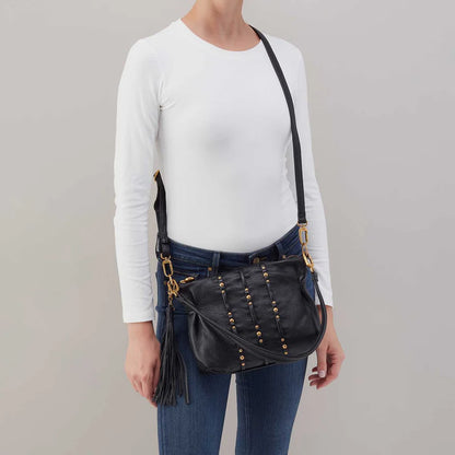 person wearing jeans and a white top with Black Kori Crossbody on the shoulder