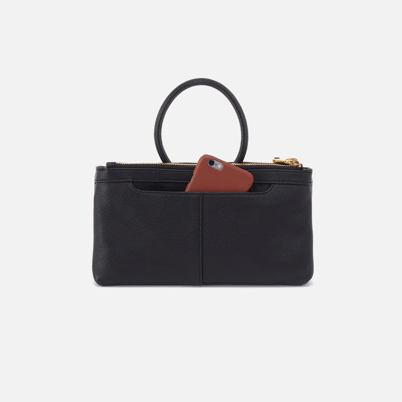 back view of black Sable Crossbody with gold details with phone in pocket