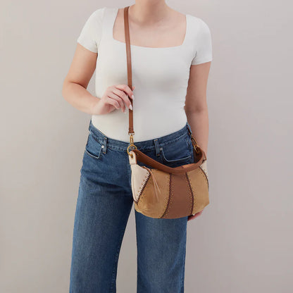 person wearing the mini opal bag in timber brown