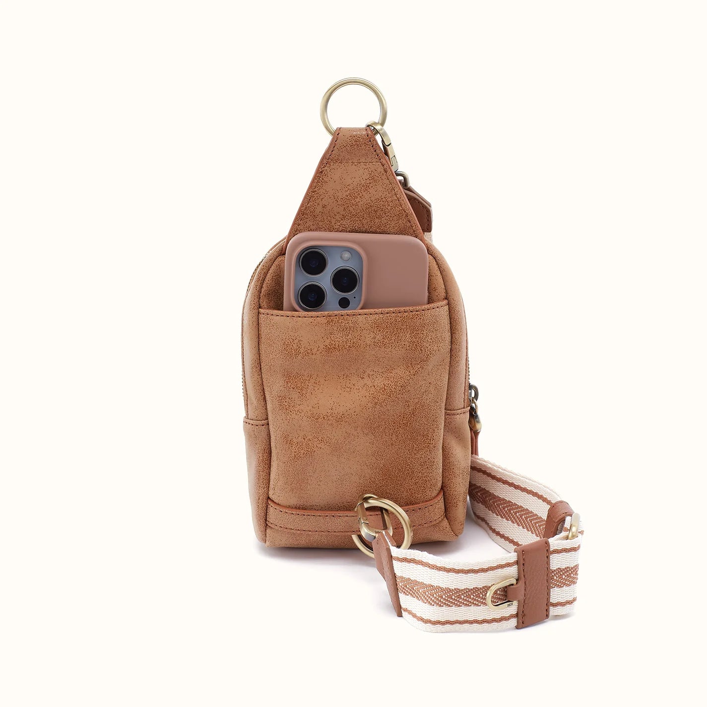 back view of the small fern sling in buffed leather whiskey