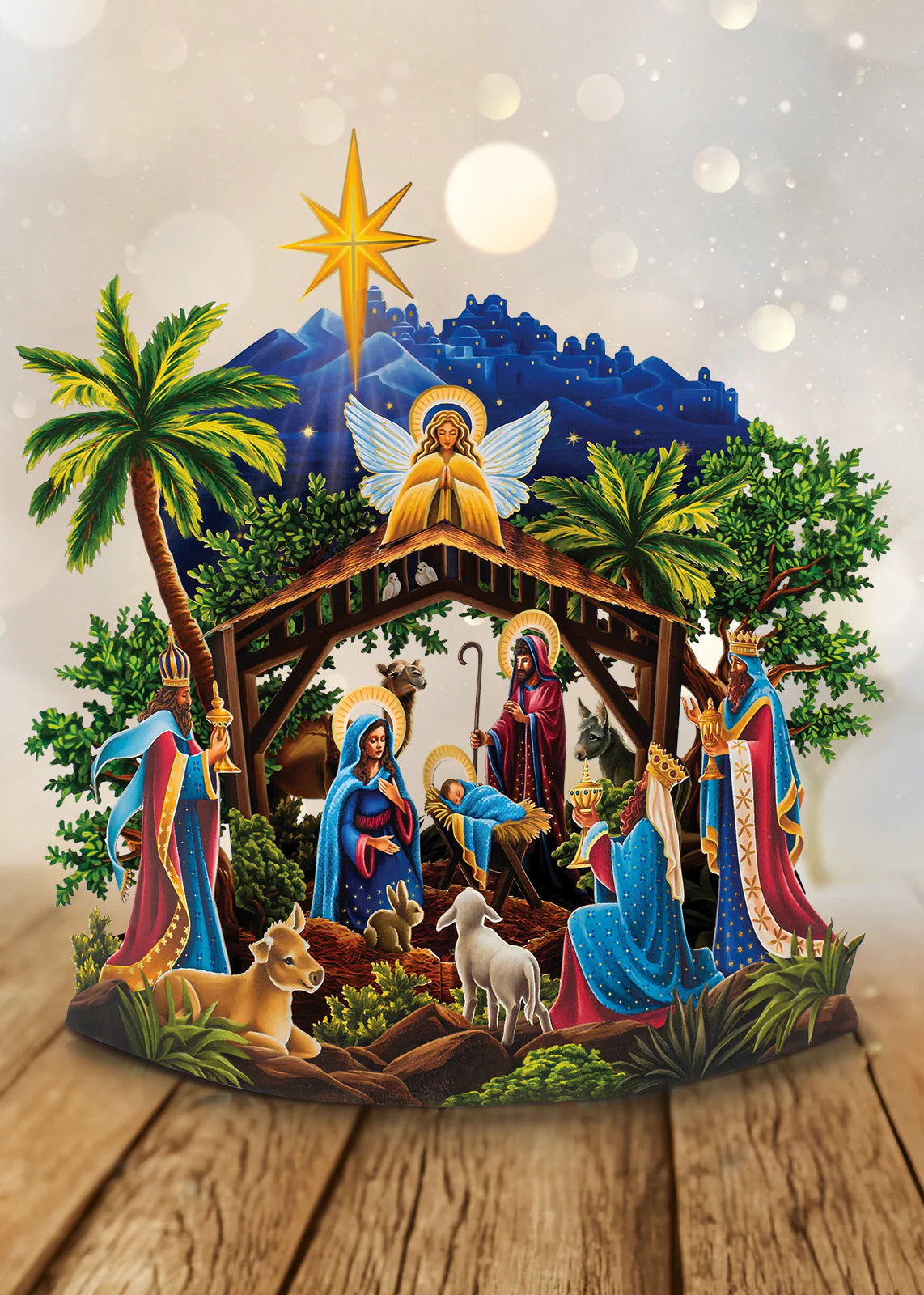 Pop-Up Starlit Nativity paper display set on a wooden table.