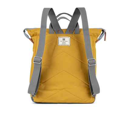 back view of yellow bantry b backpack showing shoulder straps.