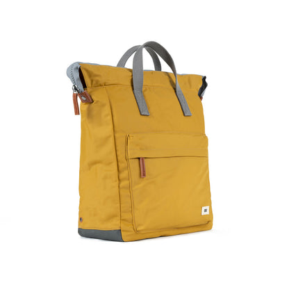 side view of yellow bantry backpack.