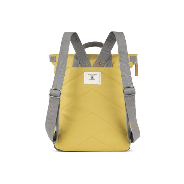 back view of yellow canfield b backpack showing shoulder straps.