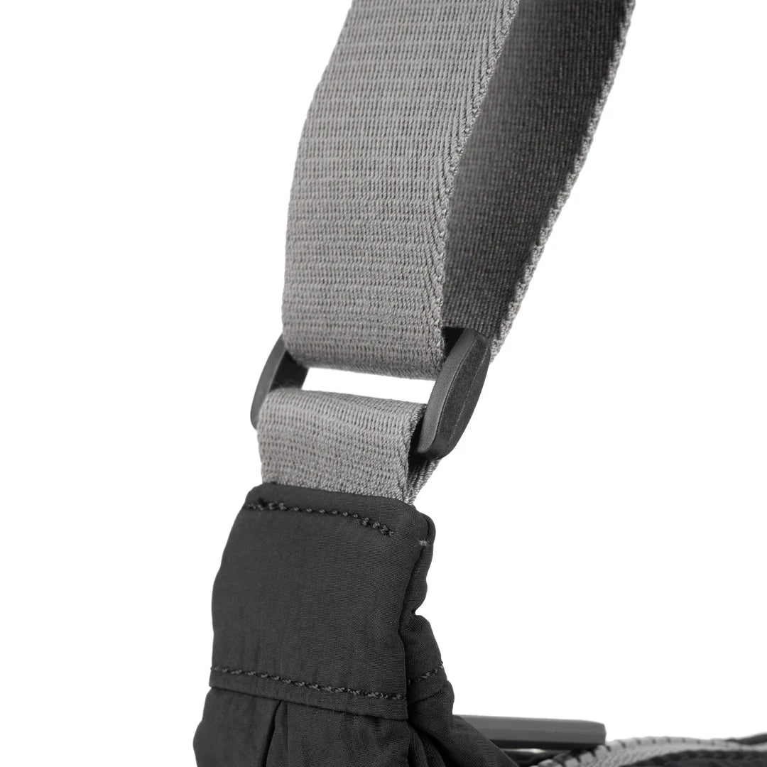 view of black farringdon sling bag handle attachment