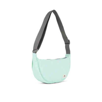 side view of mint Farringdon Sling Bag