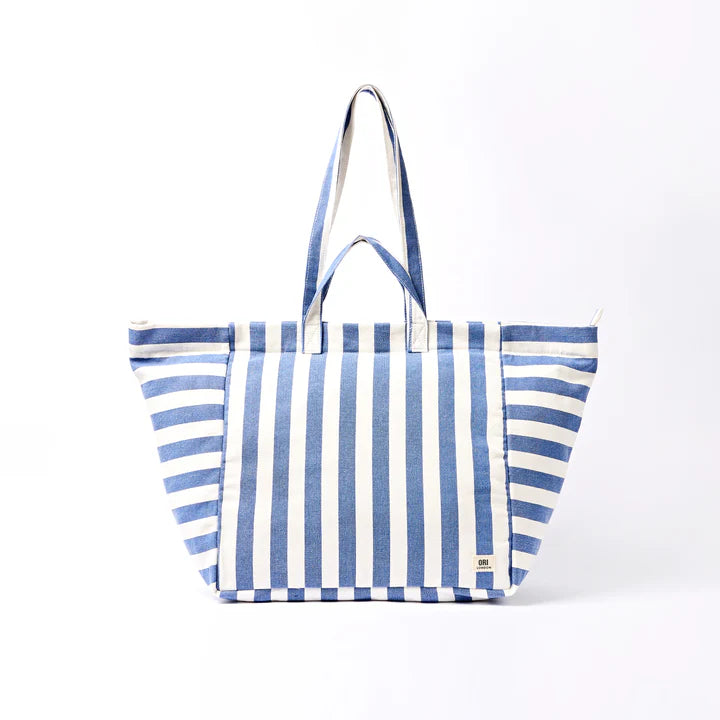 Blue and white striped tote bag on a white background